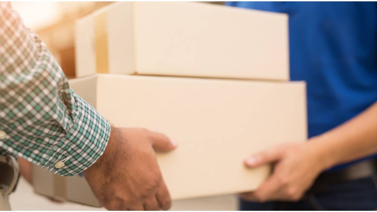 Image of people carrying boxes