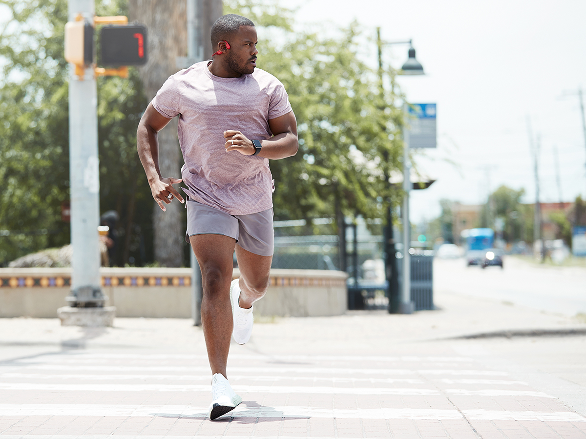 Runner running through city