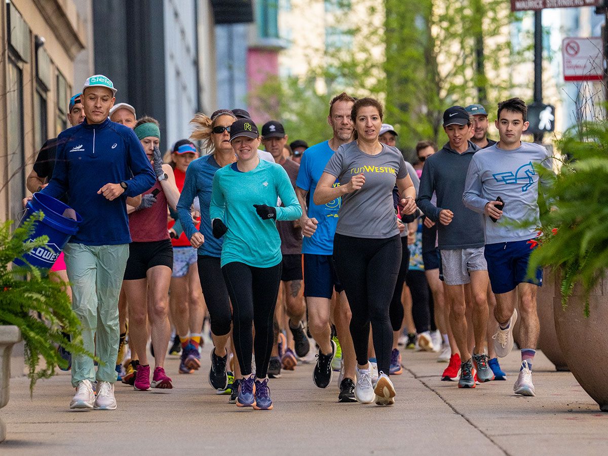 Image of runners running downtown